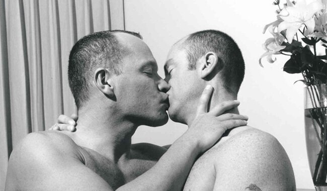 Gay couple kissing